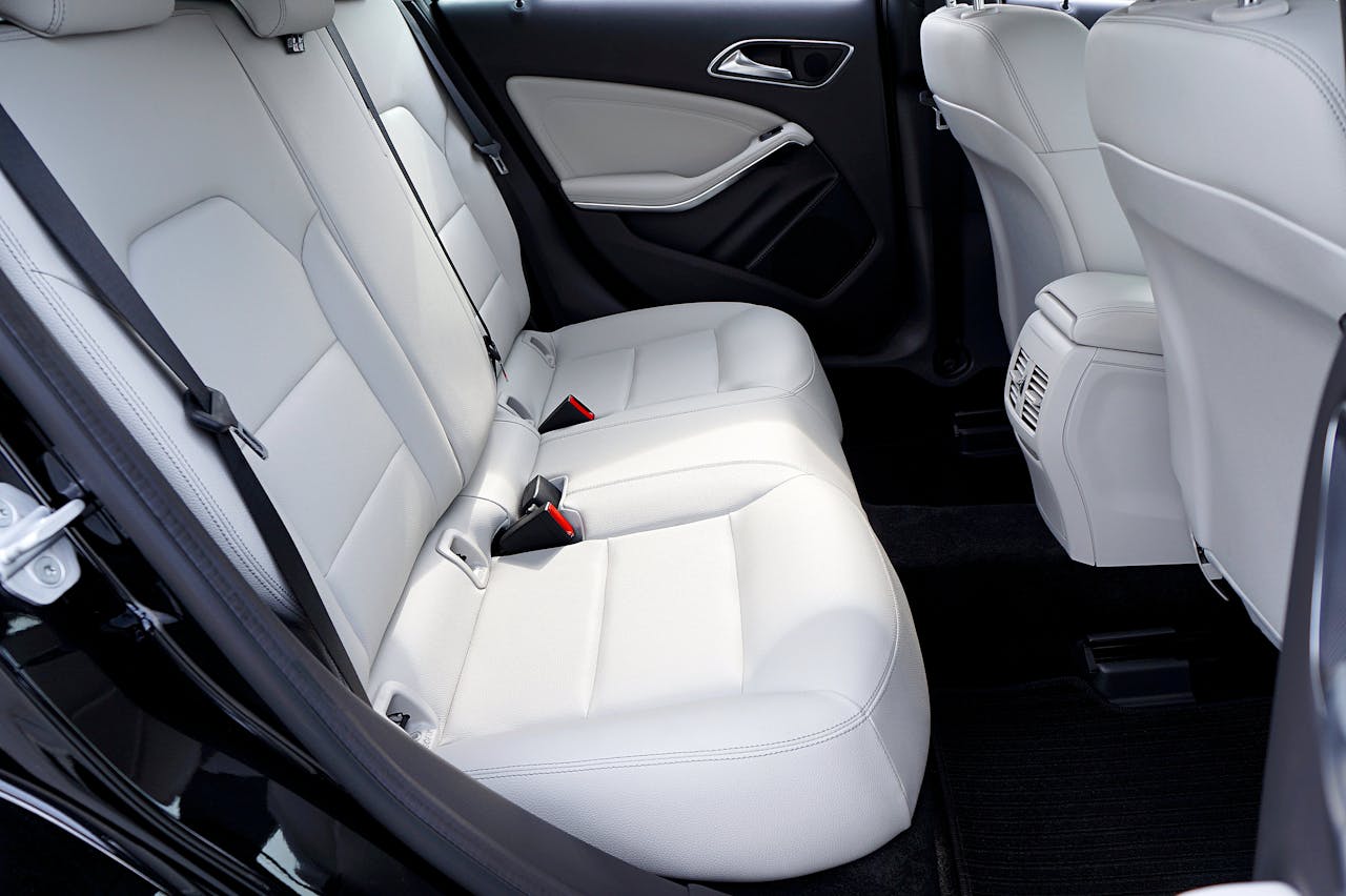 Explore the modern and luxurious feel of a cars interior with pristine white leather seats.